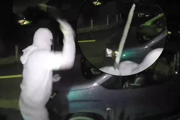Nathan Smith, 33, has been jailed for 5 years. Here he is smashing the windscreen of a vehicle, while wearing a balaclava, gloves and brandishing a machete.