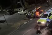 A still from a video uploaded by X account UB1UB2 West London (Southall) of a cow being rammed by a police car in Feltham on June 14, 2024 